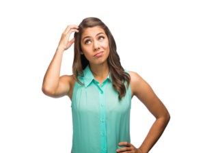 Young latin woman scratching head